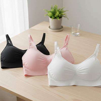 Soutien gorge allaitement sans couture lot de trois noir rose blanc sur table